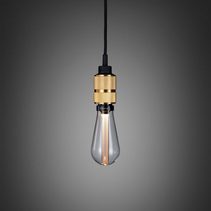 Hooked 1.0 Pendant Light / Nude Brass, front view with crystal bulb.