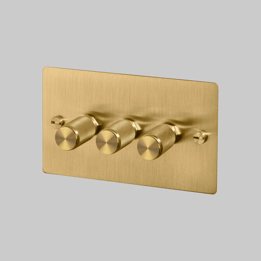 3G Dimmer/ 120W/ Brass with brass details, angled view.