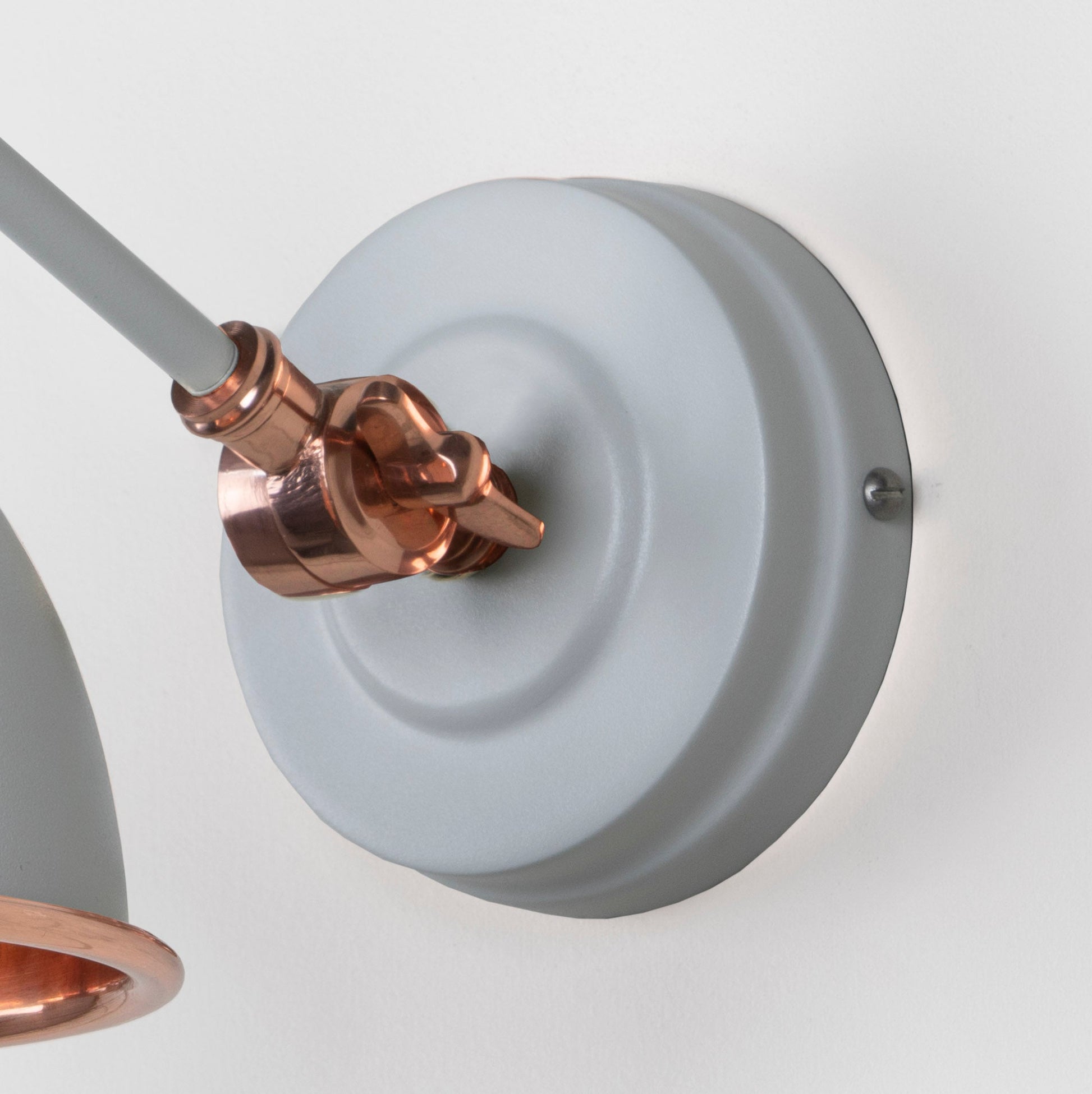 Smooth Copper Brindley Wall Light Birch, close up view of fitting and cable.