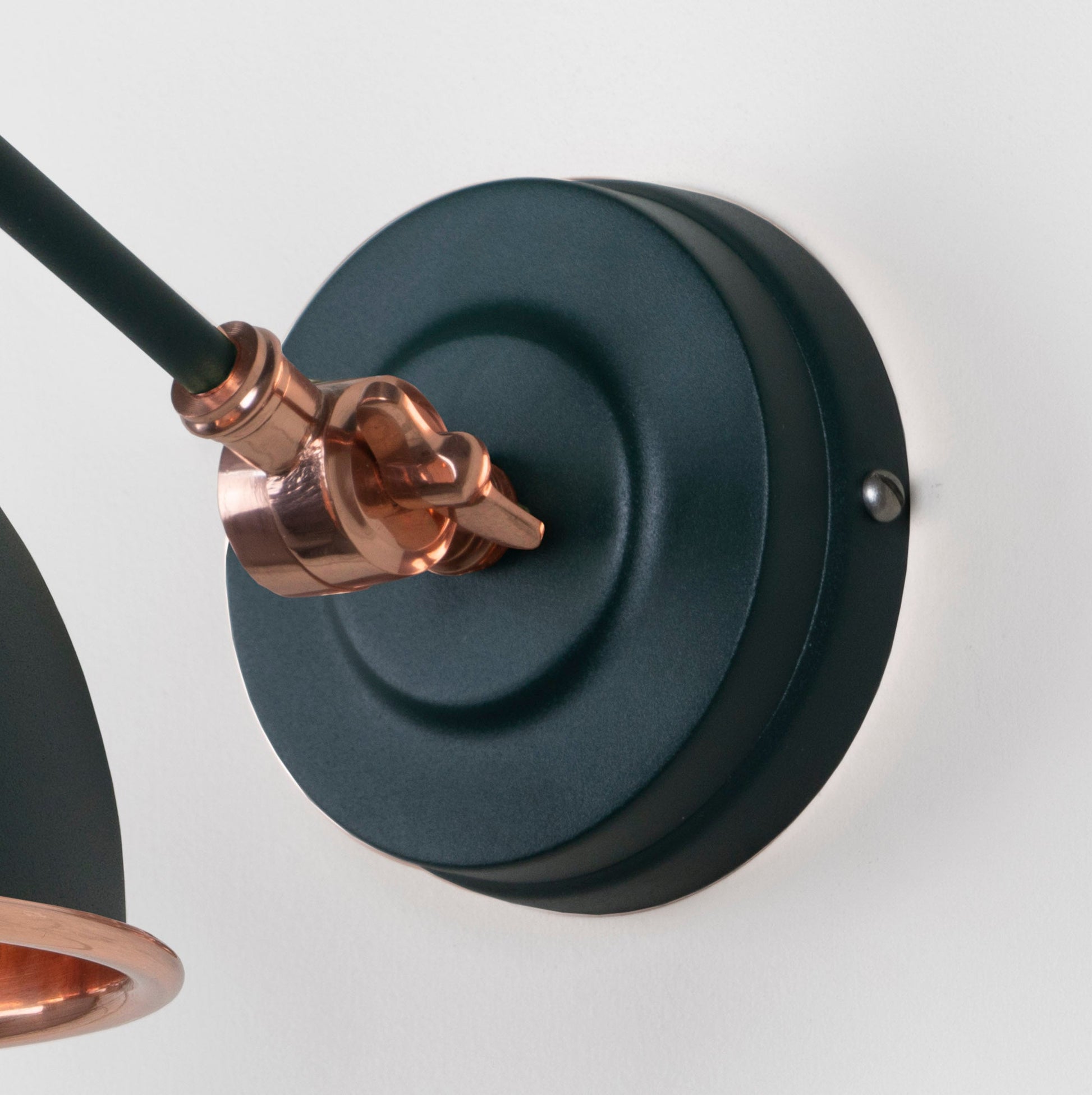 Smooth Copper Brindley Wall Light Dingle, close up view of fitting and cable.