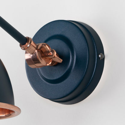 Smooth Copper Brindley Wall Light Dusk, close up view of fitting and cable.