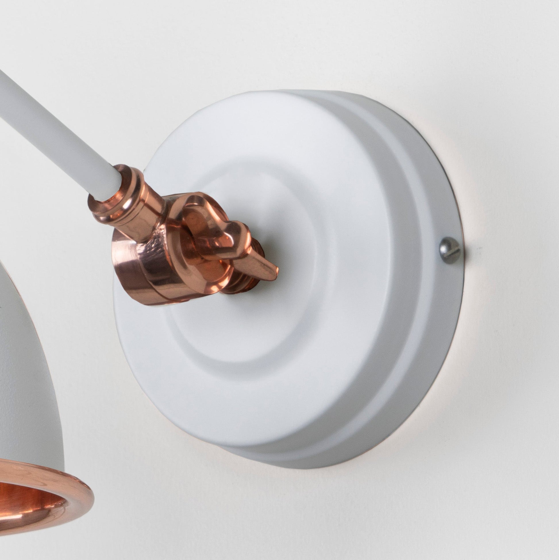 Smooth Copper Brindley Wall Light Flock, close up view of fitting and cable.