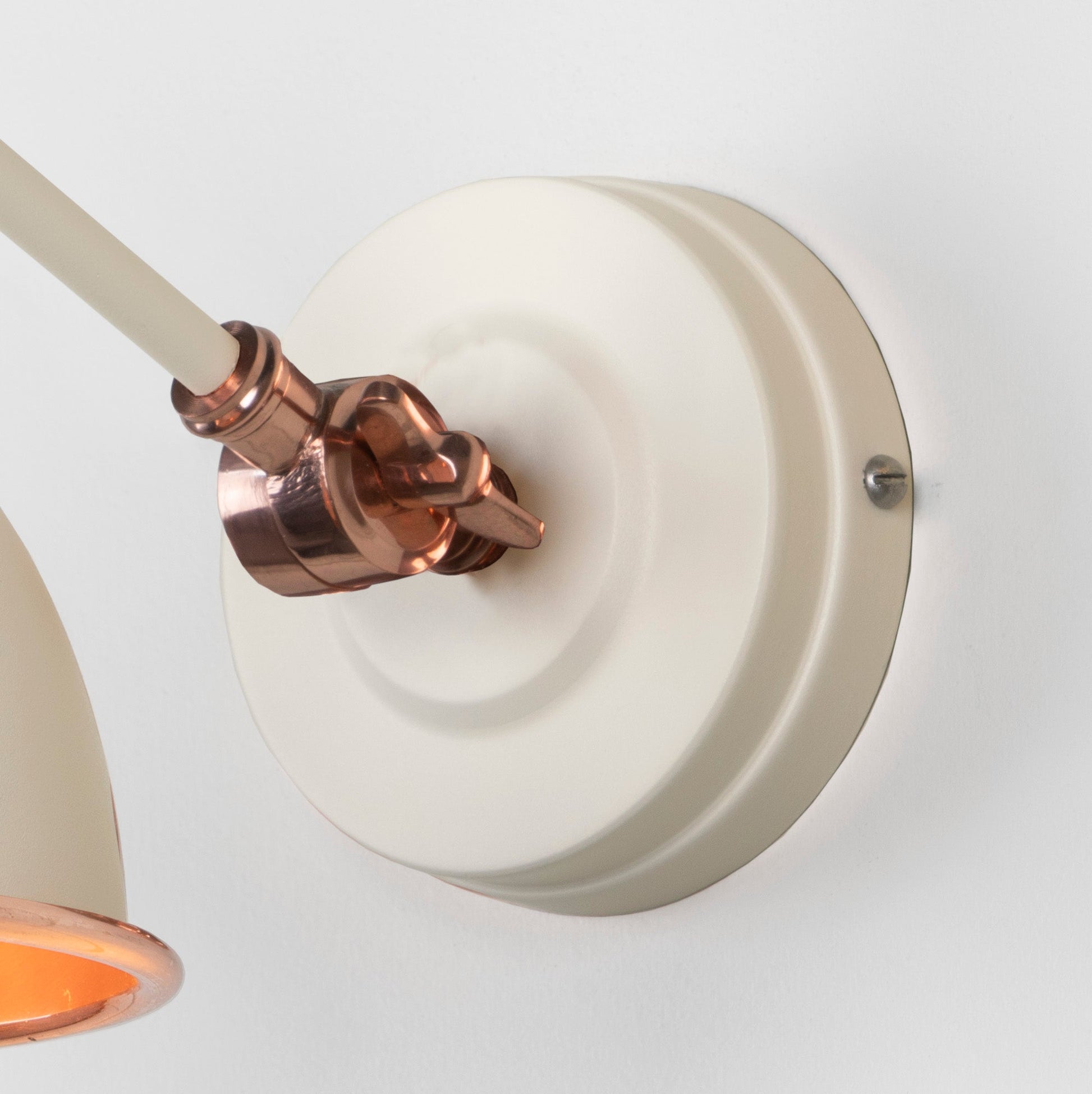 Smooth Copper Brindley Wall Light Teasel, close up view of fitting and cable.
