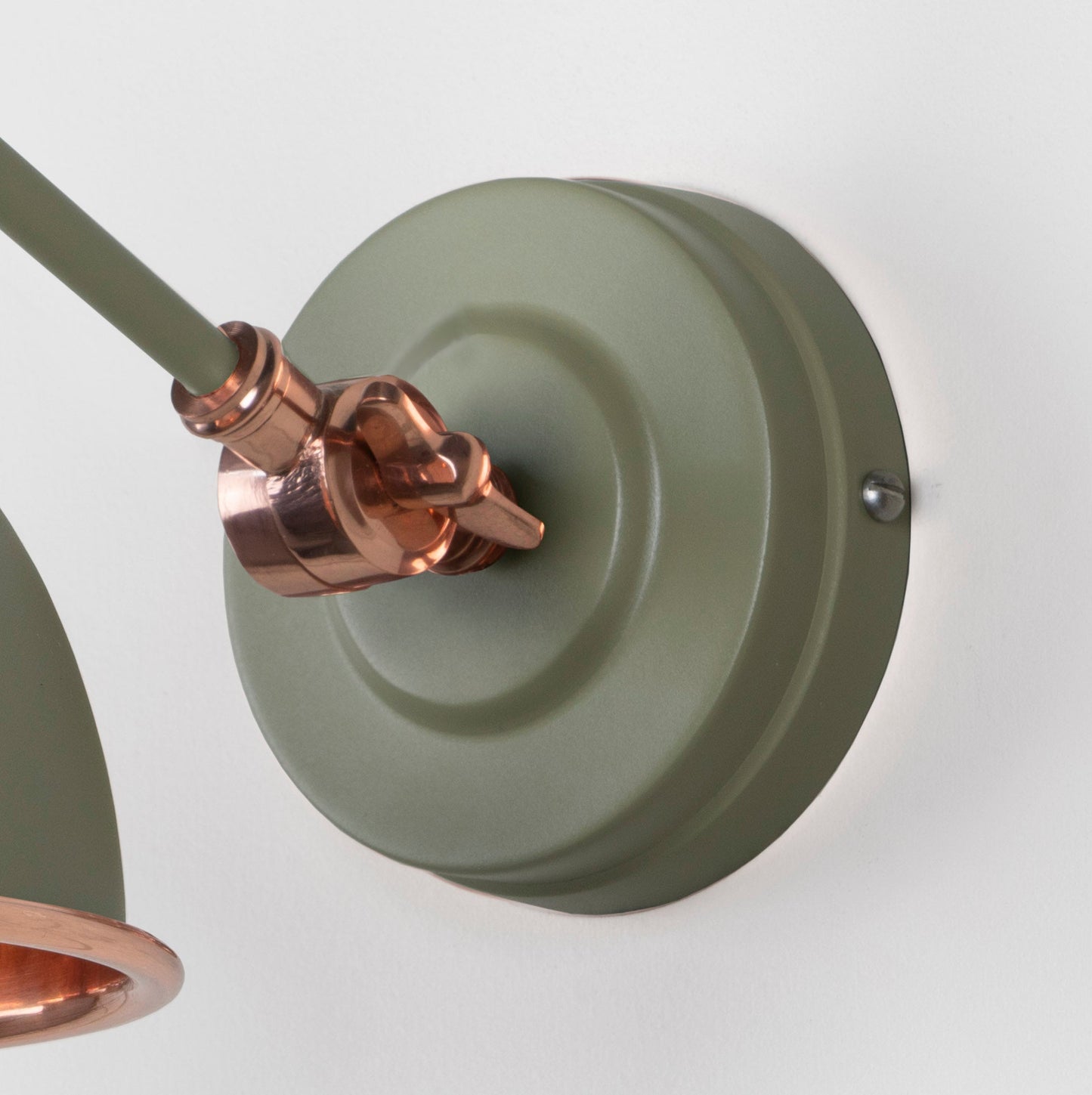 Smooth Copper Brindley Wall Light Tump, close up view of fitting and cable.