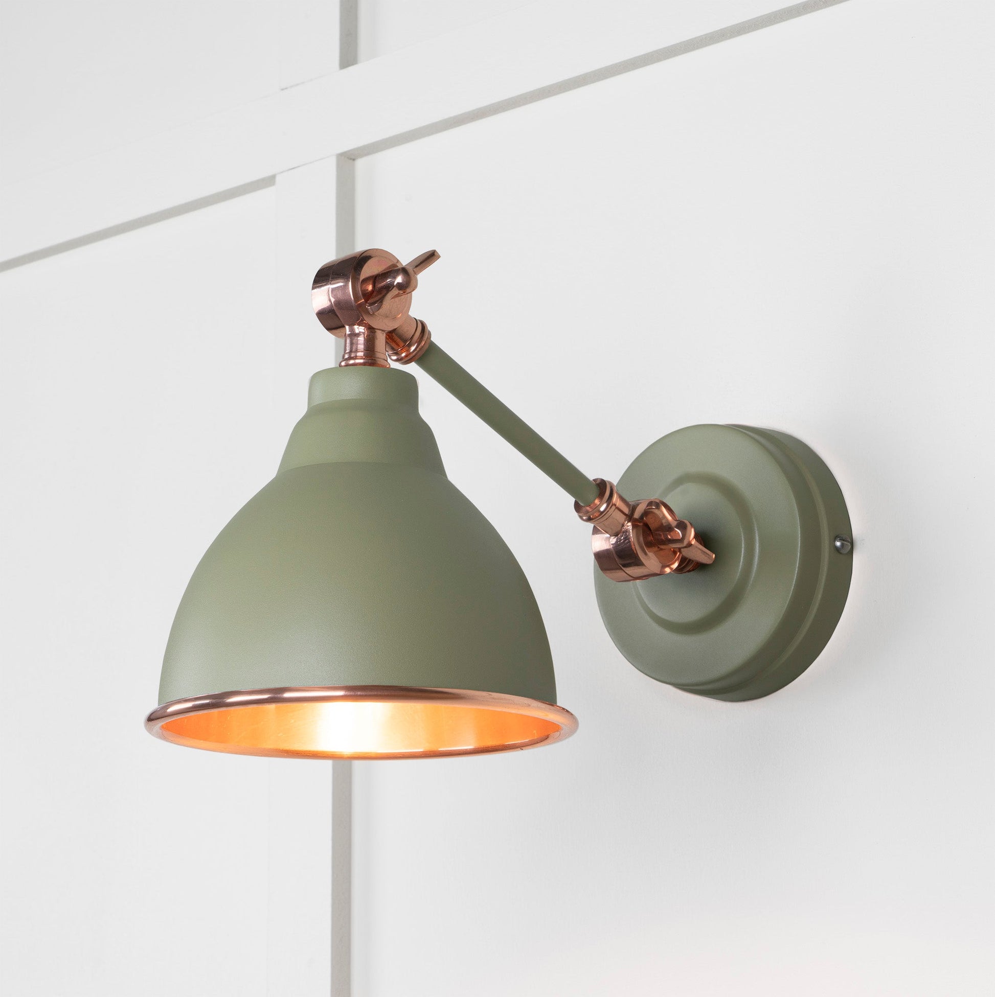 Smooth Copper Brindley Wall Light Tump, Front Side with light on.