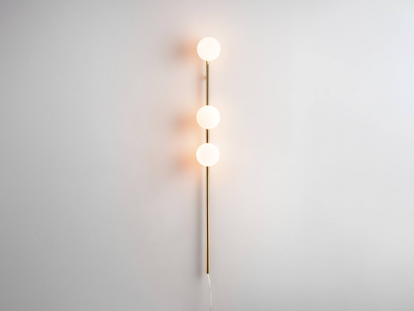 brass Bar Opal Ball Wall Light, on front view.