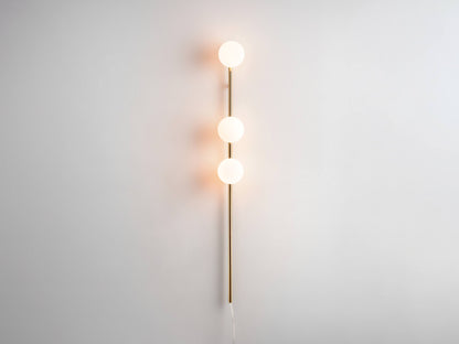 brass Bar Opal Ball Wall Light, on front view.