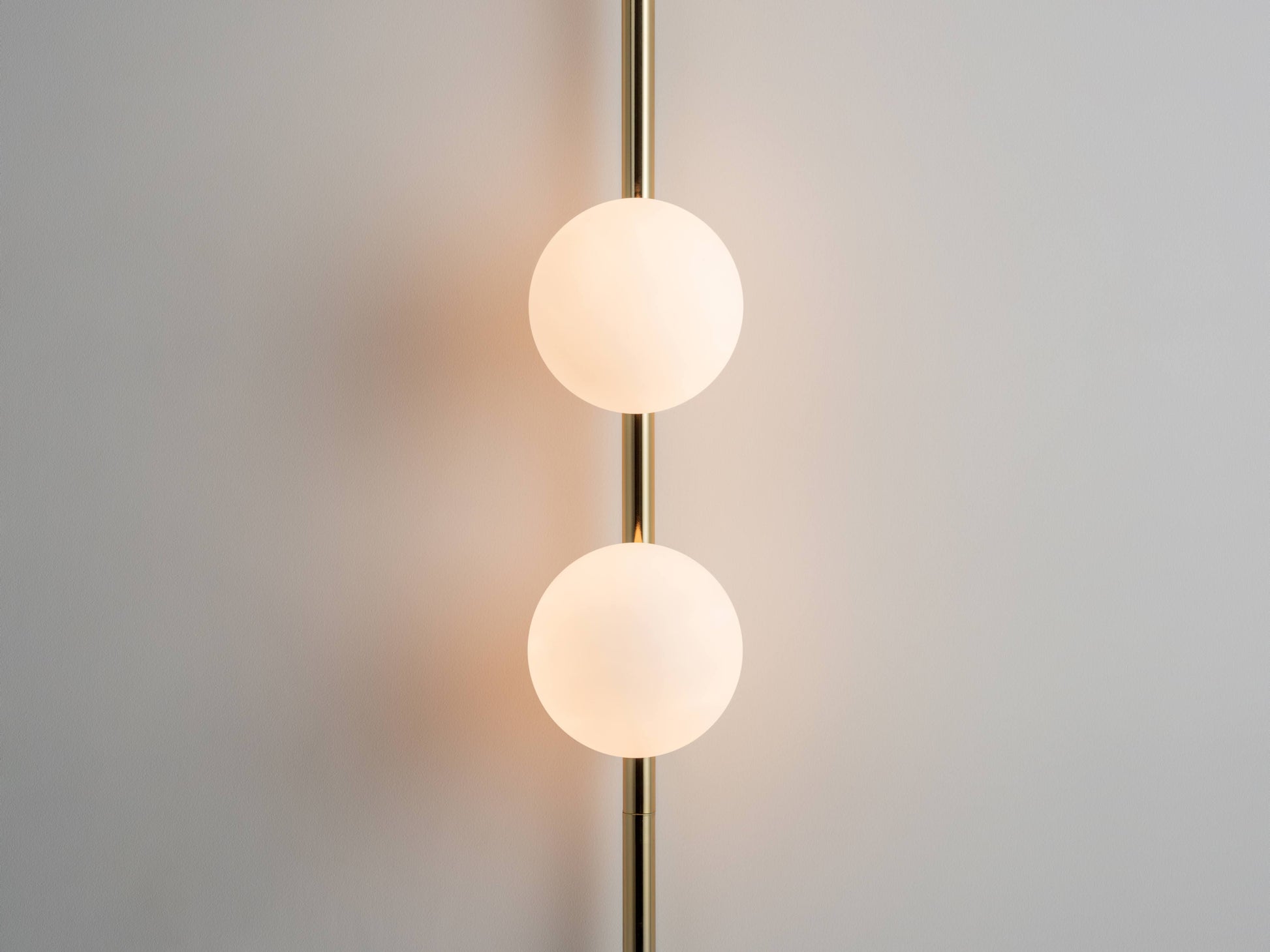 brass Bar Opal Ball Wall Light, close up opal shades.