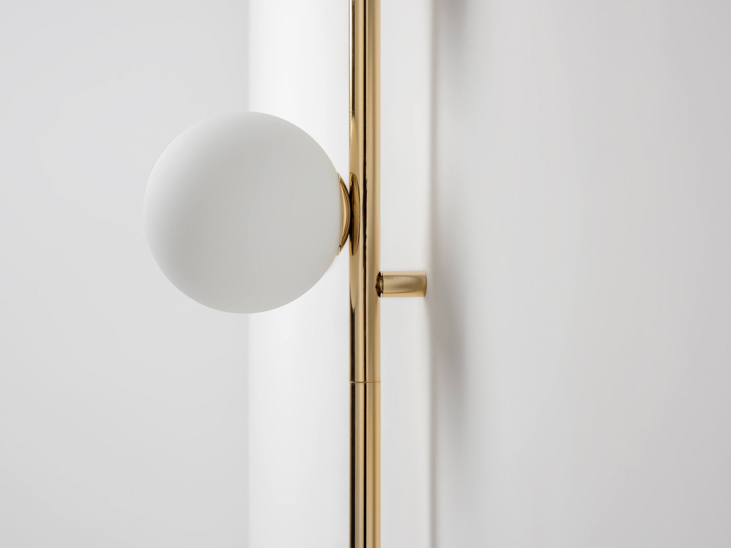 brass Bar Opal Ball Wall Light, close up opal shades and fitting.