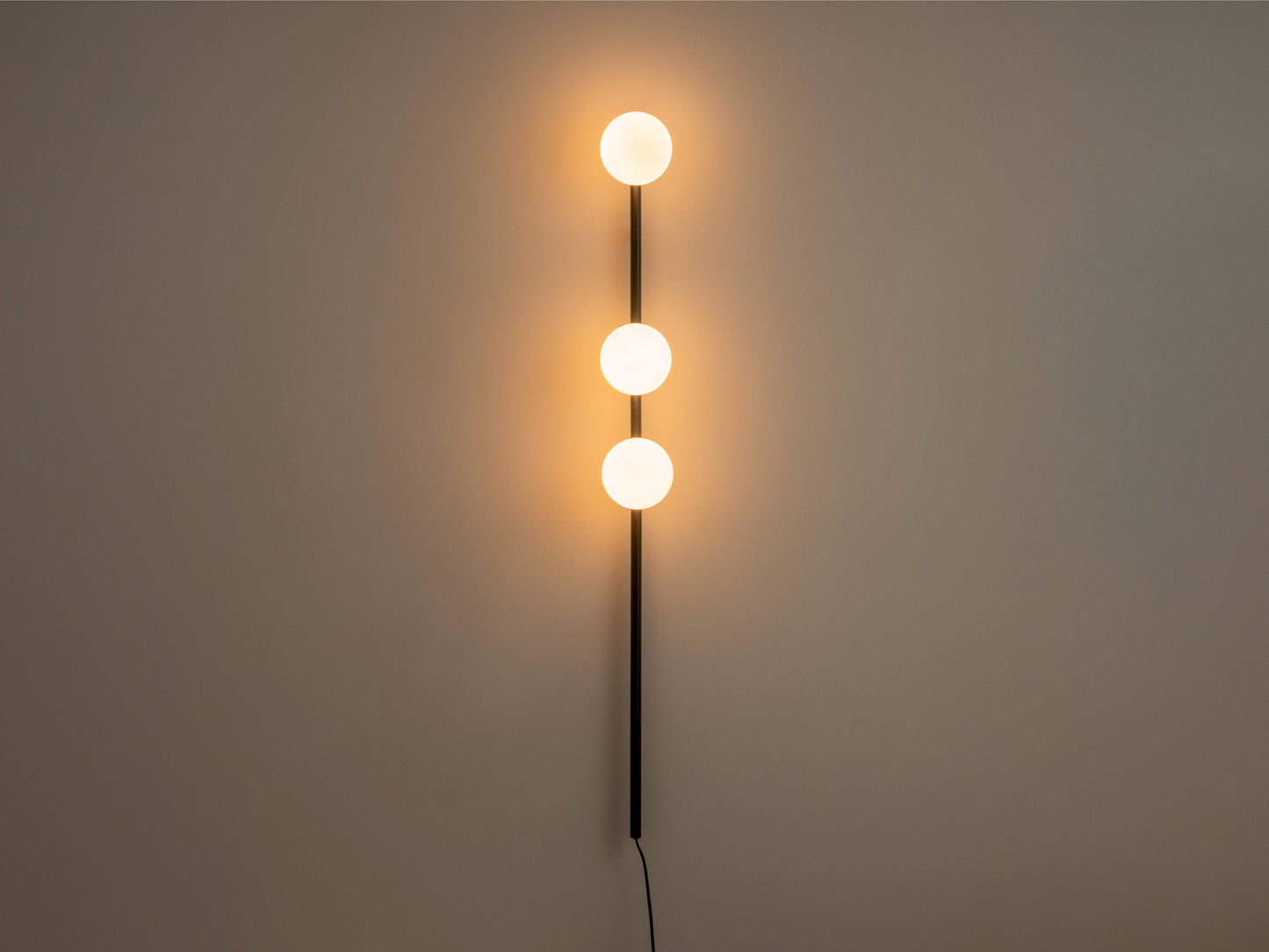 Charcoal grey Bar Opal Ball Wall Light, on front view.