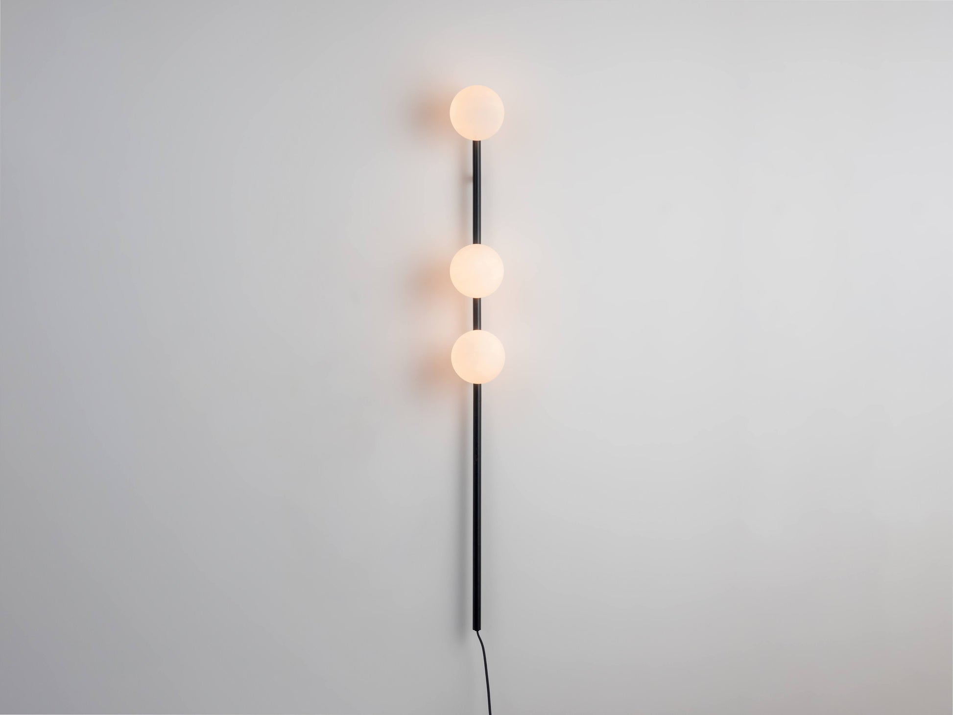 Charcoal grey Bar Opal Ball Wall Light, on front view.