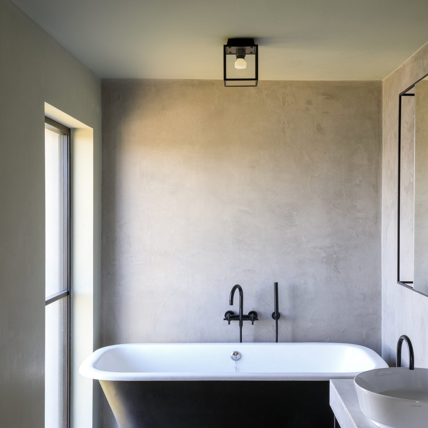 Caged Wet / Ceiling / Small gun metal, on in bathroom setting front view.