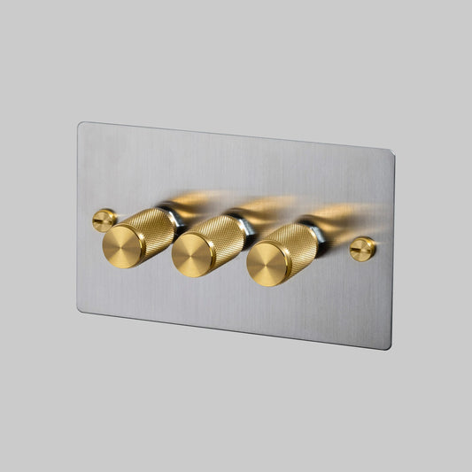 3G Dimmer/ 120W/ Steel with brass details, angled view.