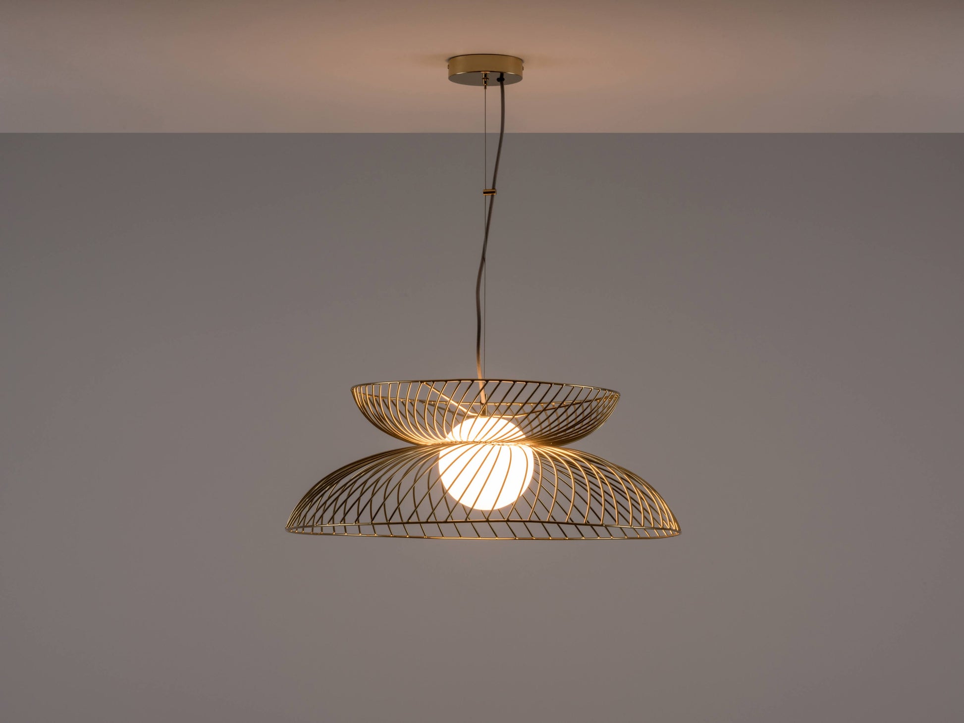 Brass Cage Ceiling Light, light on front view.