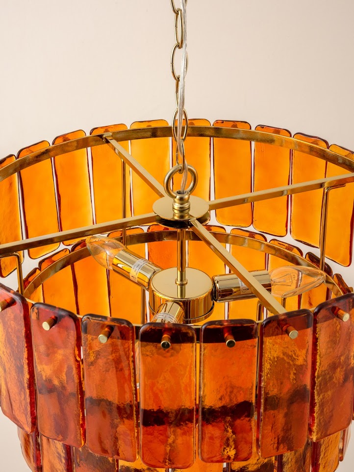 brass chained hanging Amber Glass chandelier ceiling light, top view.