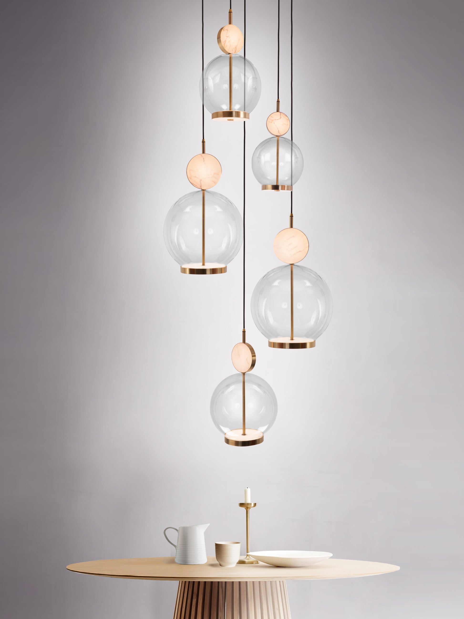 Rosa 5 Cluster Light, hanging from ceiling above table.