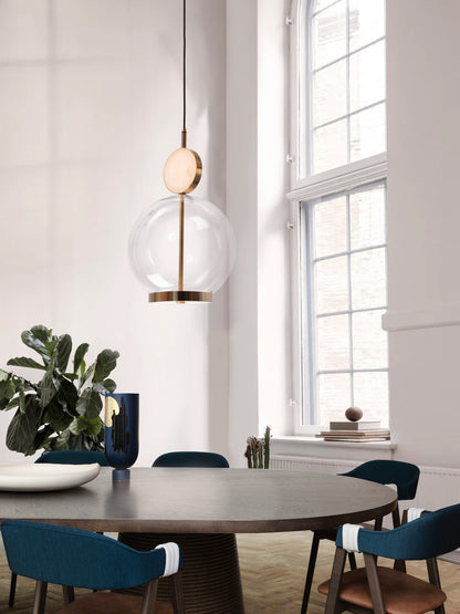 Rosa Pendant Light, hanging from ceiling above table.