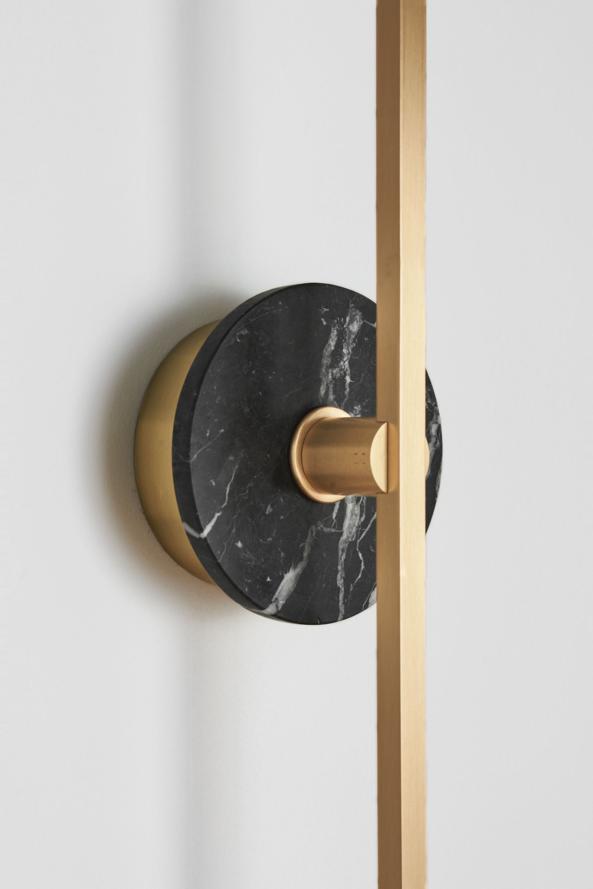 Stick Wall Light brass & Black marble, close up of fitting