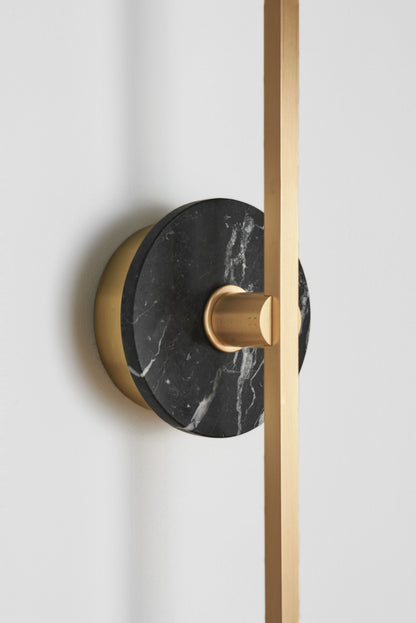 Stick Wall Light brass & Black marble, close up of fitting