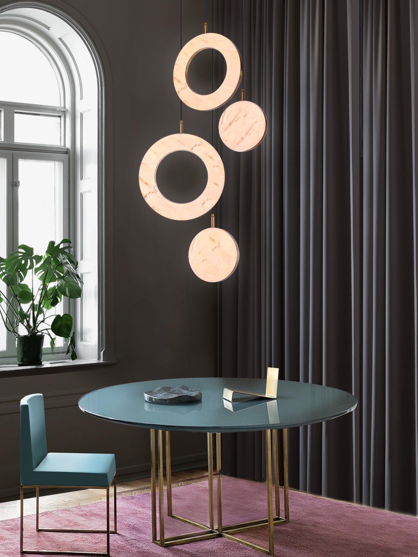 Rosa Ring 4 Cluster Light, hanging from ceiling above table in setting.