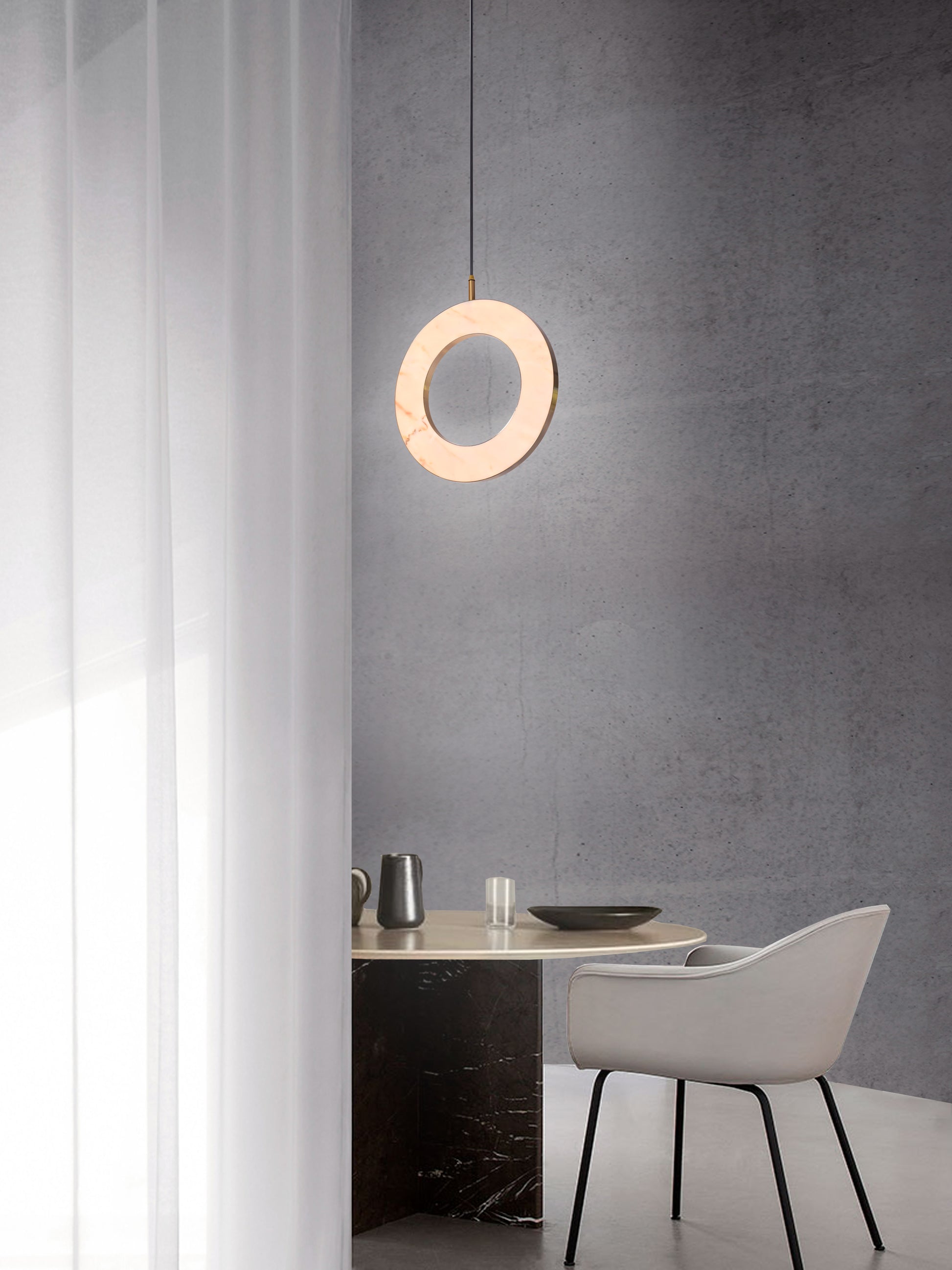 Rosa Ring Pendant Light, hanging from ceiling above table in setting.