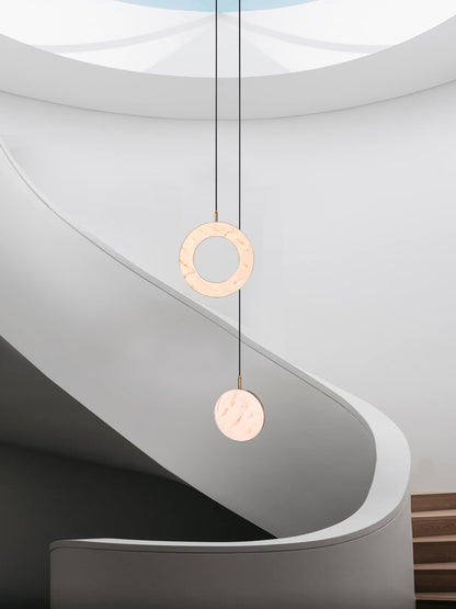 Rosa Ring 2 Cluster Light, hanging from ceiling in stairs in setting.