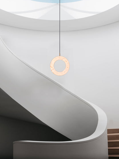 Rosa Ring Pendant Light, hanging from ceiling above stairs in setting.