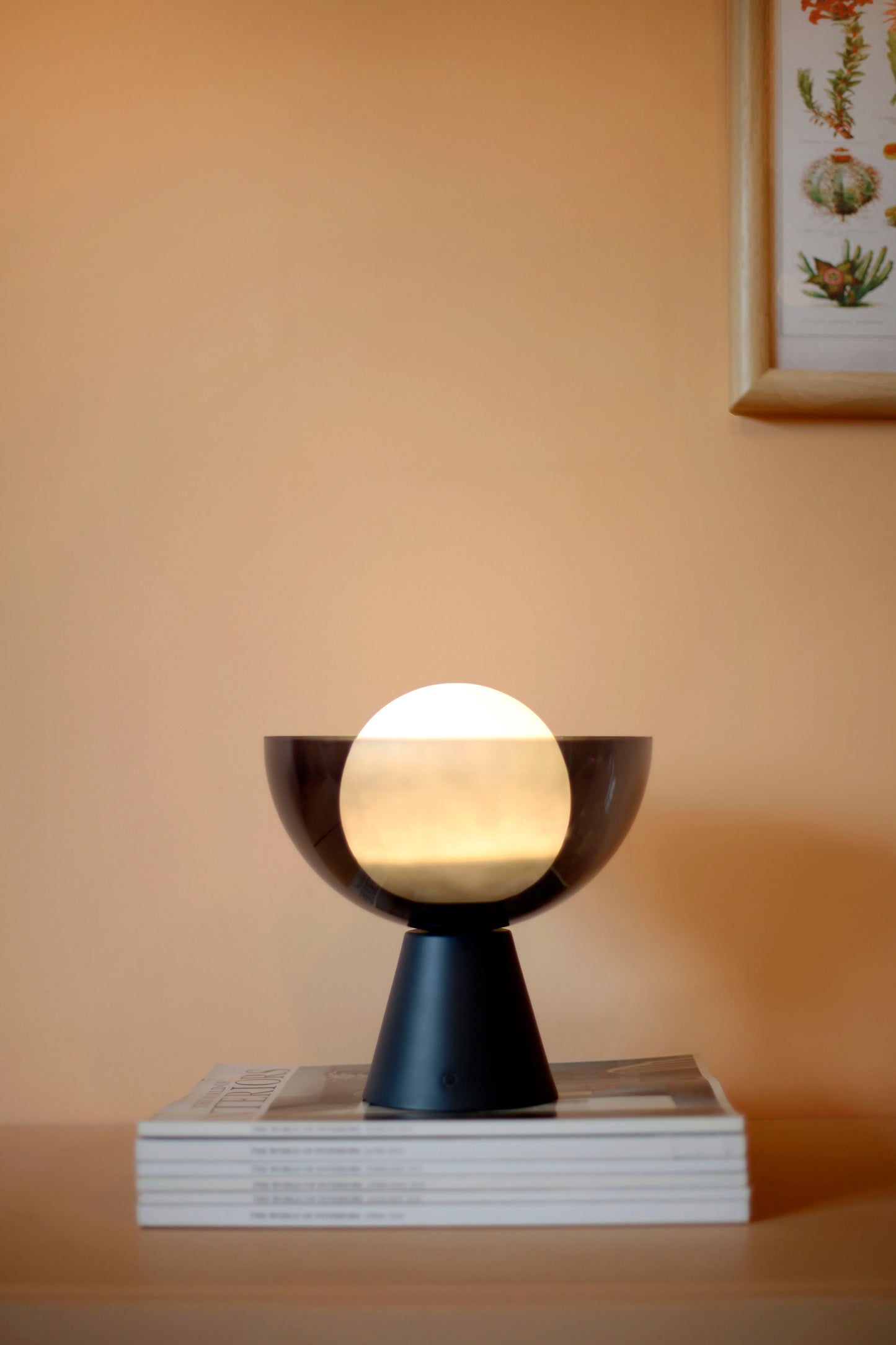Charcoal grey rechargeable table lamp, on in setting.