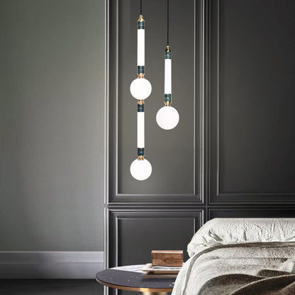 Greenstone Large Pendant Light, hanging from ceiling above bedside table. 